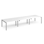 Long back-to-back desk with white top and silver metal frame on a white background