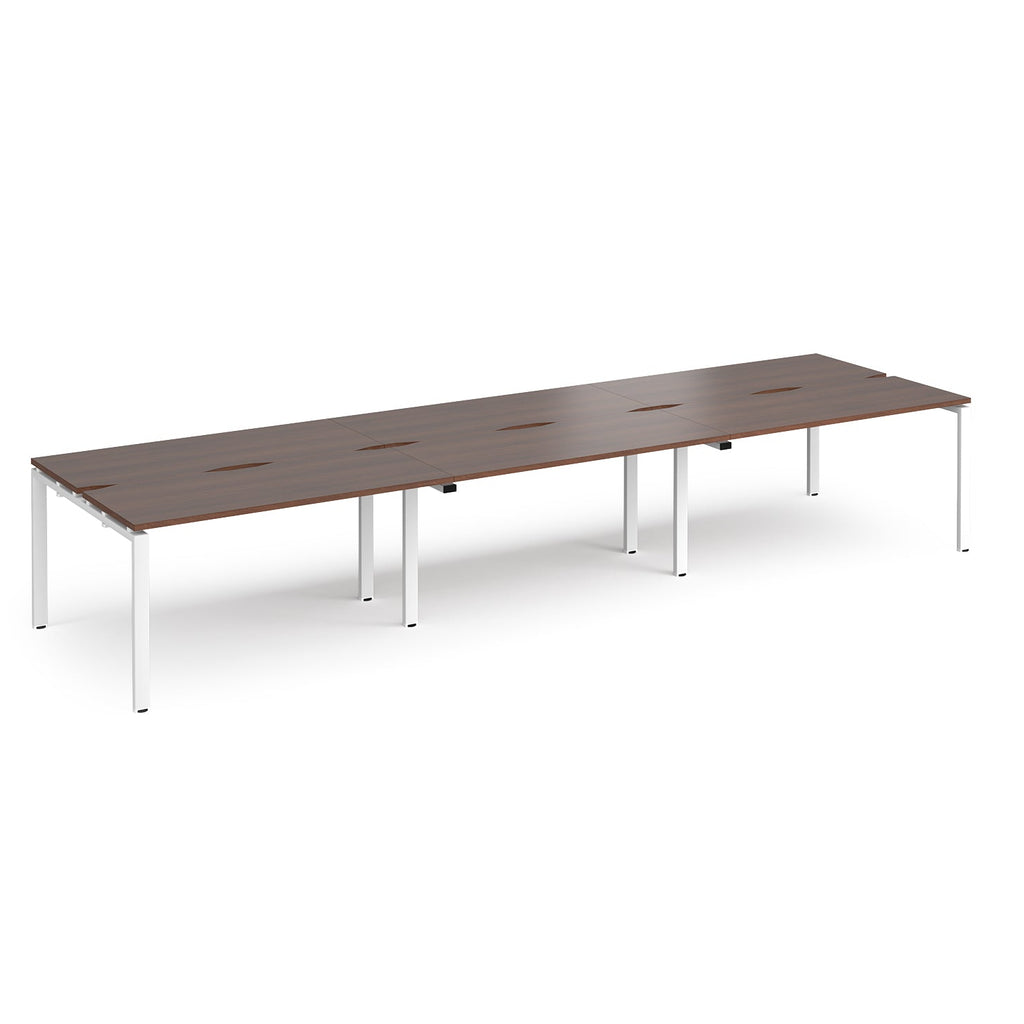 Long back-to-back desk with wood-effect top and white metal frame on a white background
