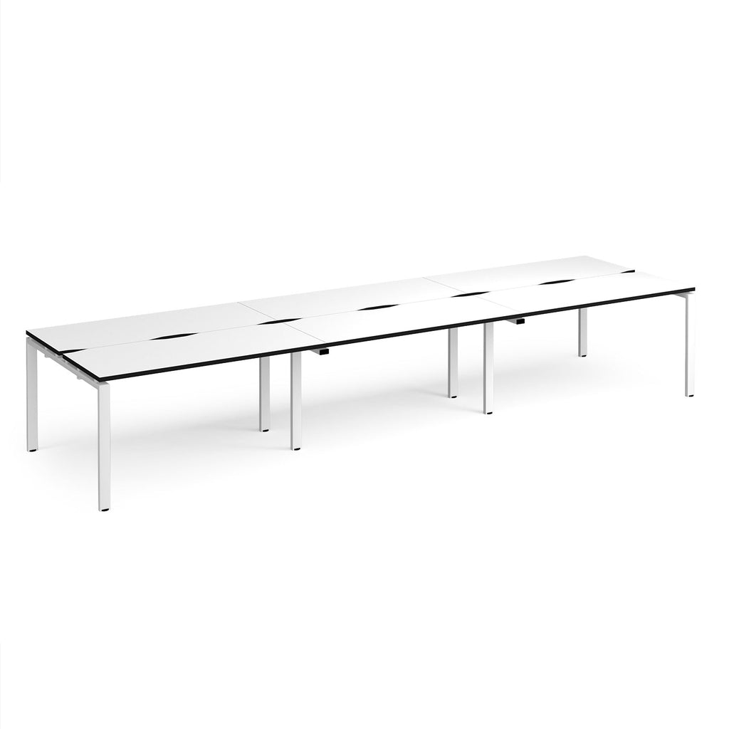 Long back-to-back desk with white top with black edges and white metal frame on a white background