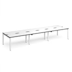 Long back-to-back desk with white top with black edges and white metal frame on a white background