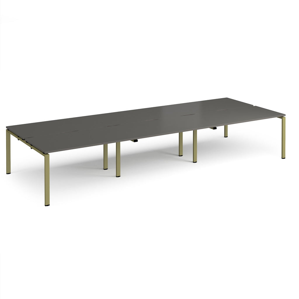 Long back-to-back desk with grey top and green metal frame on a white background