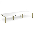 Long back-to-back desk with white top and green metal frame on a white background