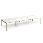 Long back-to-back desk with white top with wooden edges and green metal frame on a white background