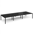 Black long back-to-back desk with metal frame on a white background