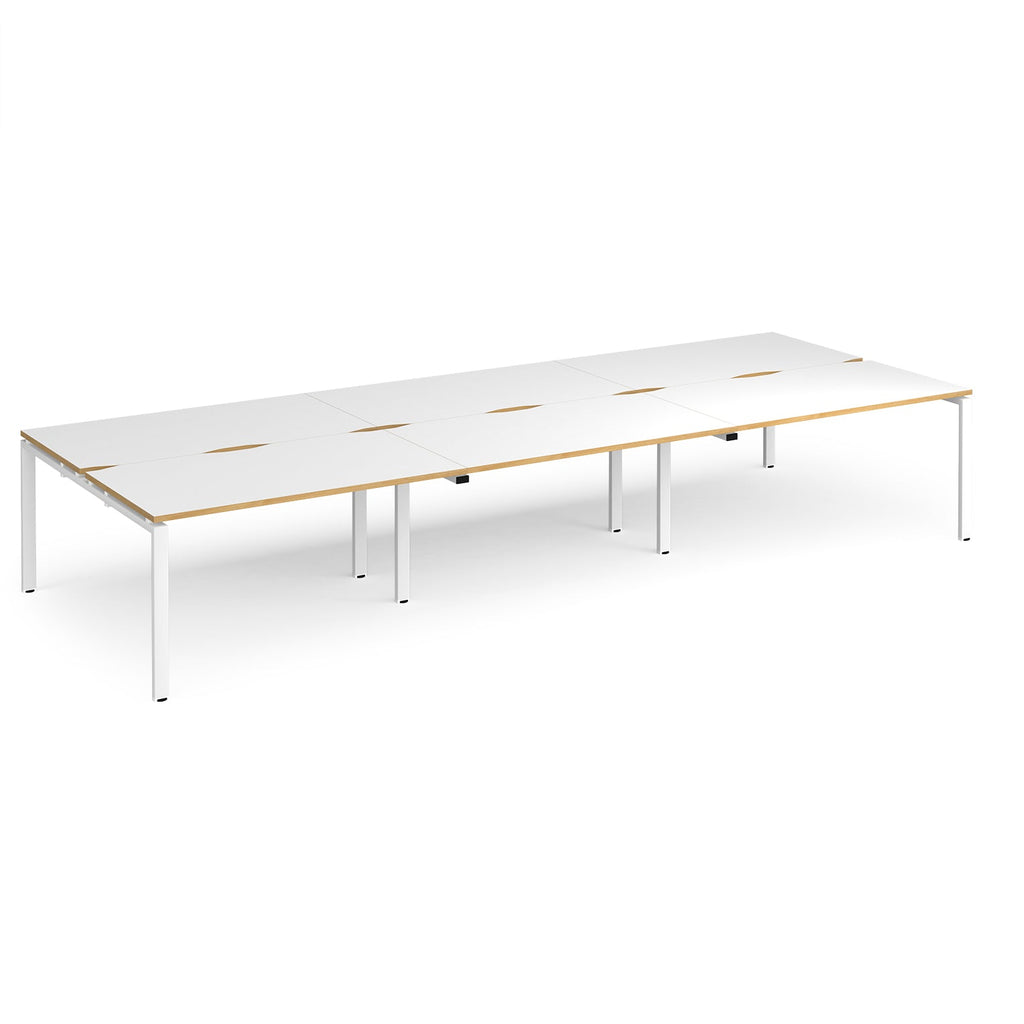 Long back-to-back desk with white top with wooden edges and green metal frame on a white background