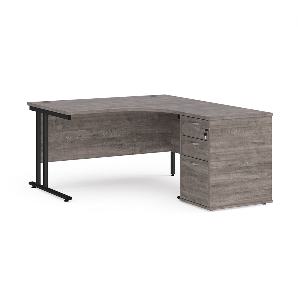 Wooden corner desk with metal legs and matching pedestal on a white background