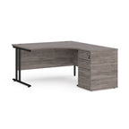 Wooden corner desk with metal legs and matching pedestal on a white background