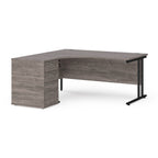 Wooden corner desk with metal legs and matching pedestal on a white background