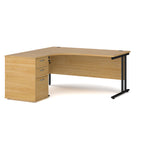 Wooden corner desk with metal legs and matching pedestal on a white background