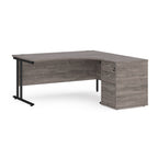 Wooden corner desk with metal legs and matching pedestal on a white background