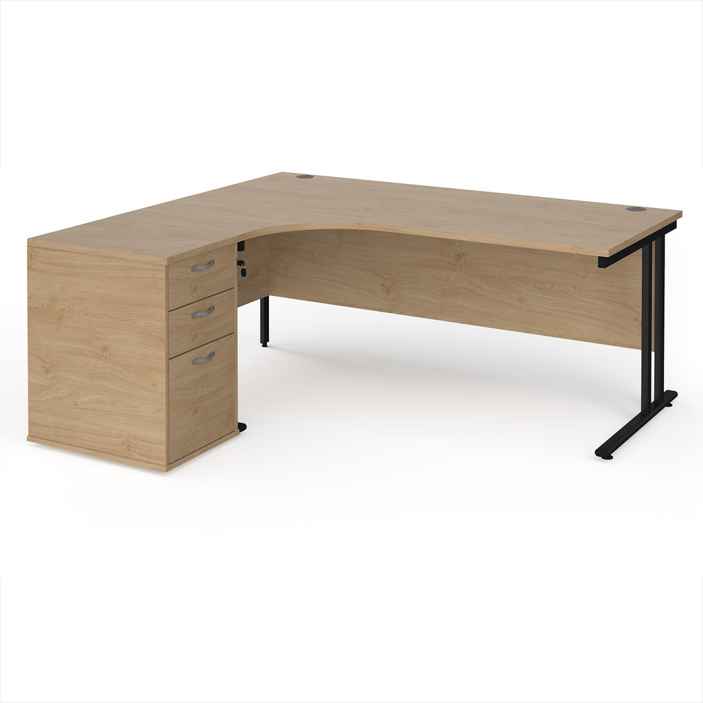 Wooden corner desk with metal legs and matching pedestal on a white background