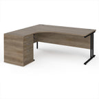 Wooden corner desk with metal legs and matching pedestal on a white background