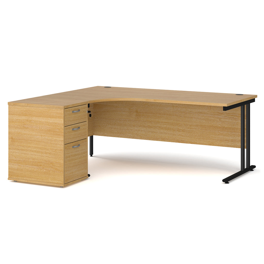 Wooden corner desk with metal legs and matching pedestal on a white background