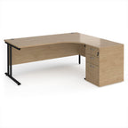 Wooden corner desk with metal legs and matching pedestal on a white background