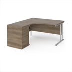 Wooden corner desk with metal legs and matching pedestal on a white background