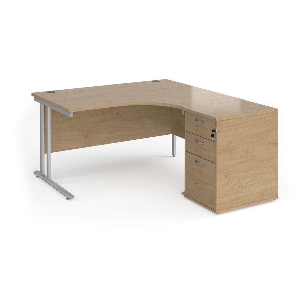 Wooden corner desk with metal legs and matching pedestal on a white background