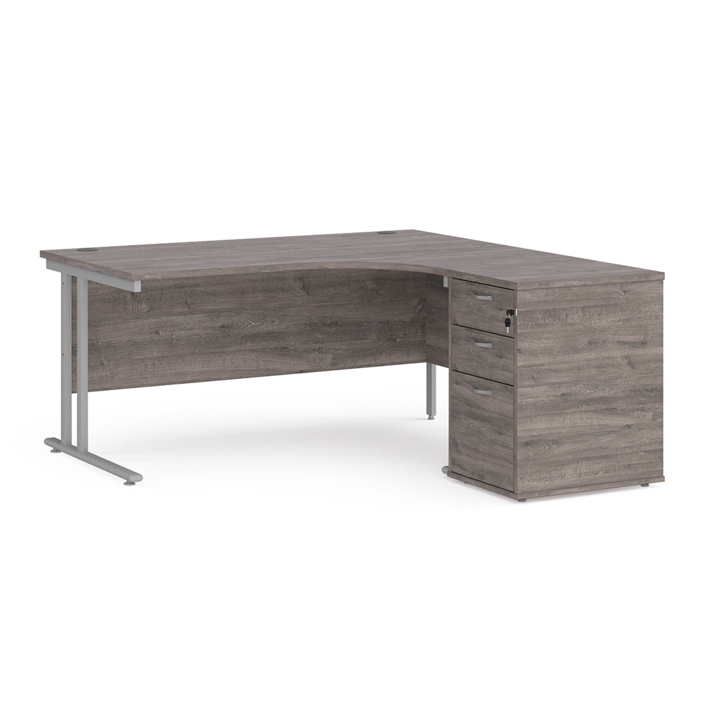 Wooden corner desk with metal legs and matching pedestal on a white background