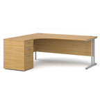 Wooden corner desk with metal legs and matching pedestal on a white background