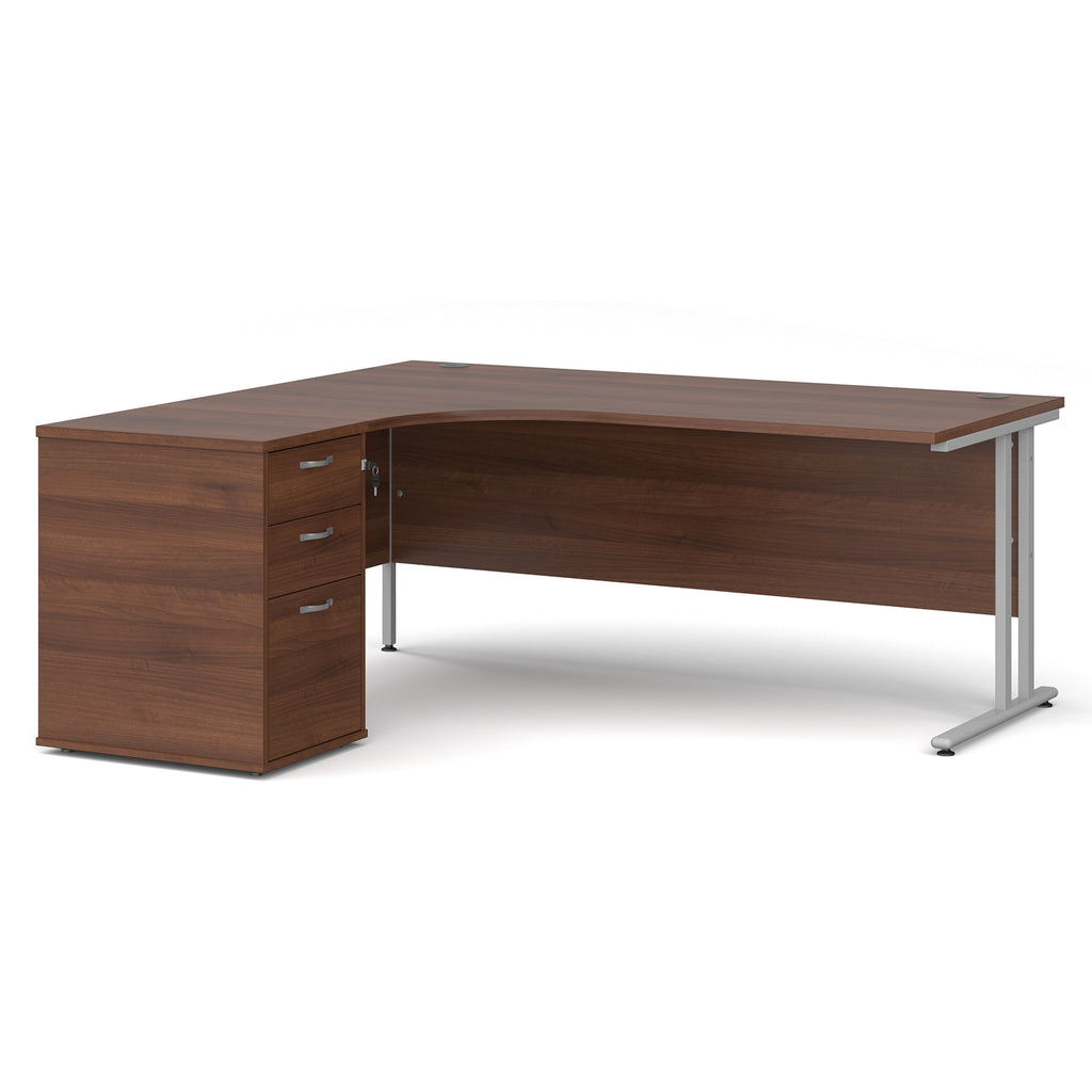 Wooden corner desk with metal legs and matching pedestal on a white background
