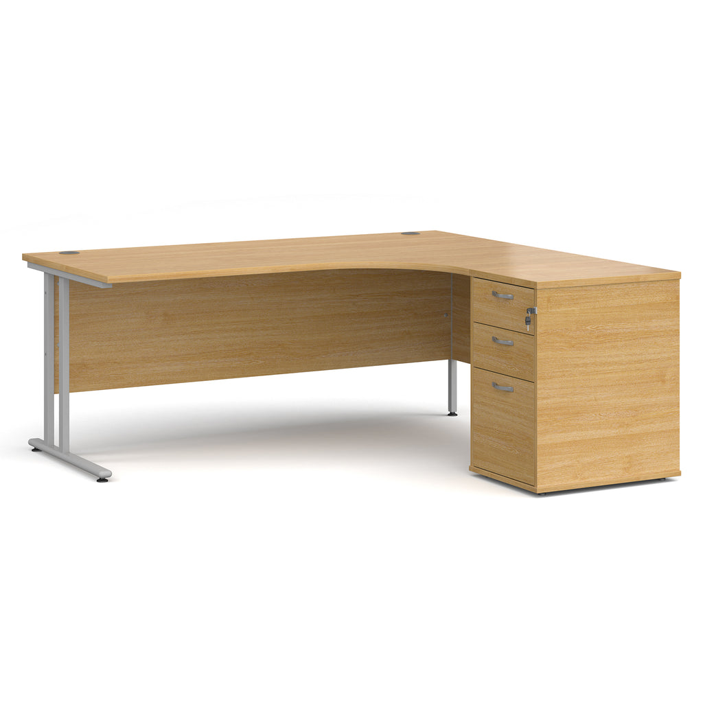 Wooden corner desk with metal legs and matching pedestal on a white background