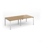 A rectangular office table with a light oak wood grain top and slim white metal legs, shown on a clean white background.