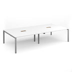 Rectangular meeting table with white top with two cut-outs and silver metal frame on a white background