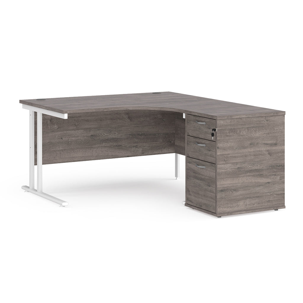 Wooden corner desk with metal legs and matching pedestal on a white background