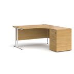 Wooden corner desk with metal legs and matching pedestal on a white background