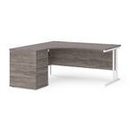 Wooden corner desk with metal legs and matching pedestal on a white background