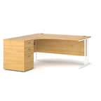 Wooden corner desk with metal legs and matching pedestal on a white background