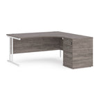 Wooden corner desk with metal legs and matching pedestal on a white background