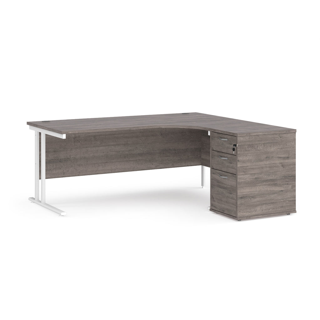 Wooden corner desk with metal legs and matching pedestal on a white background