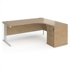 Wooden corner desk with metal legs and matching pedestal on a white background
