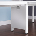 White office desk with a dark wood floor and light blue wall.