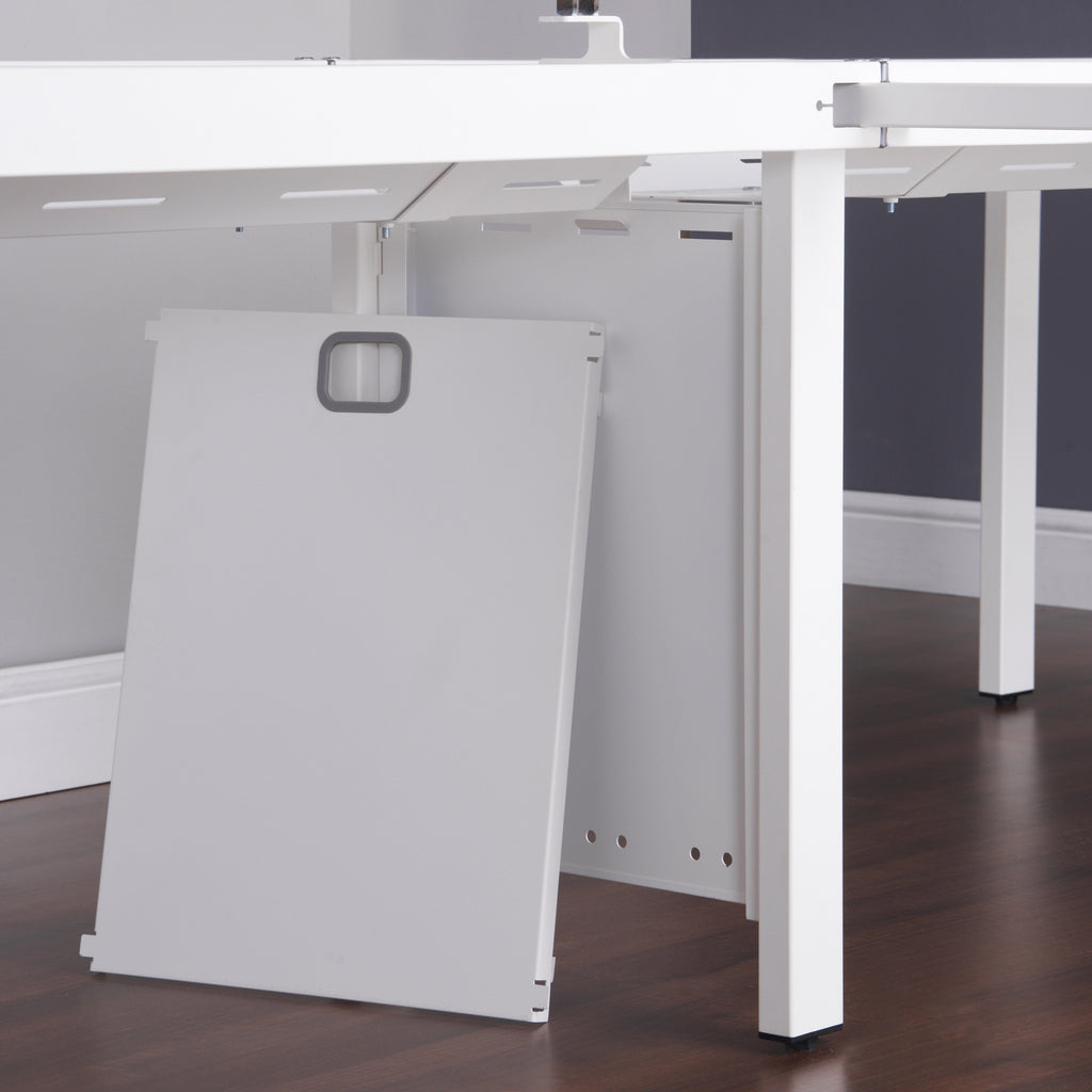 White office desk with a cable riser in an office setting
