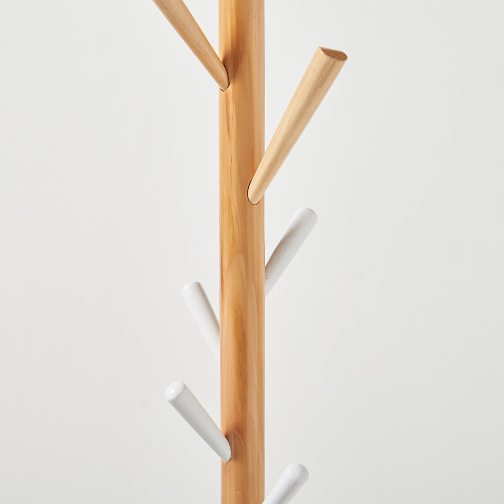 Wooden and white coat rack on a light grey background