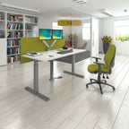 Modern office setting with a desk, chair, and computer, with a bookcase in the background