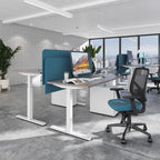 Modern office setup with a desk, chair, and computer monitor in a bright room.