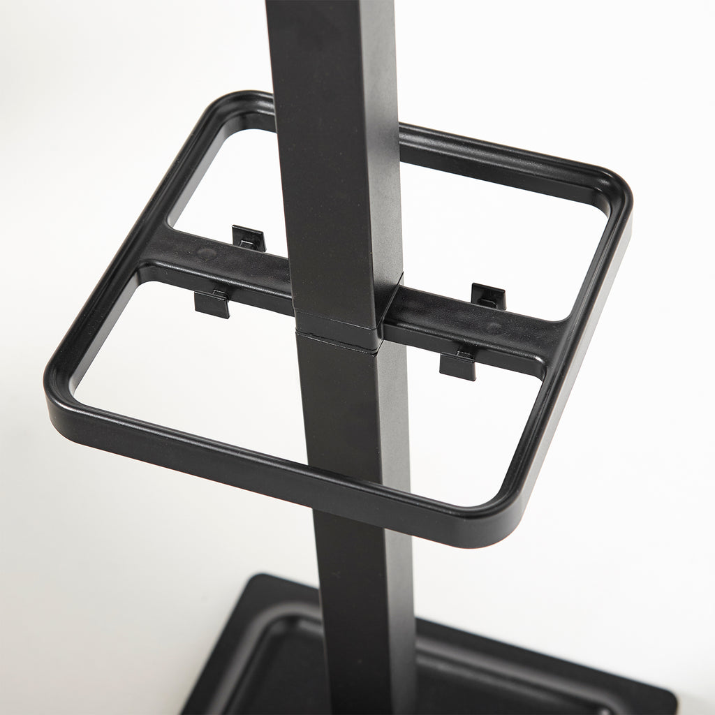 Close-up of a black metal stand on a white background