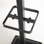 Close-up of a black metal stand on a white background