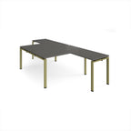 L-shaped grey desks with wood-effect top and a green metal frame on a white background