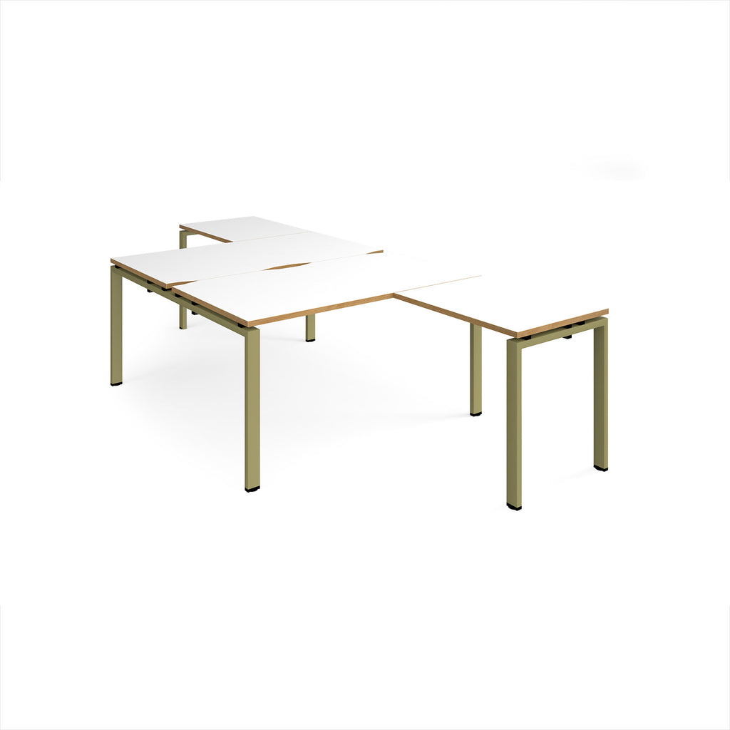 L-shaped back-to-back desks with white top with wooden edges and a green metal frame on a white background