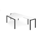 L-shaped back-to-back desks with white top and a black metal frame on a white background