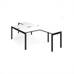 L-shaped back-to-back desks with white top with black edges and a black metal frame on a white background