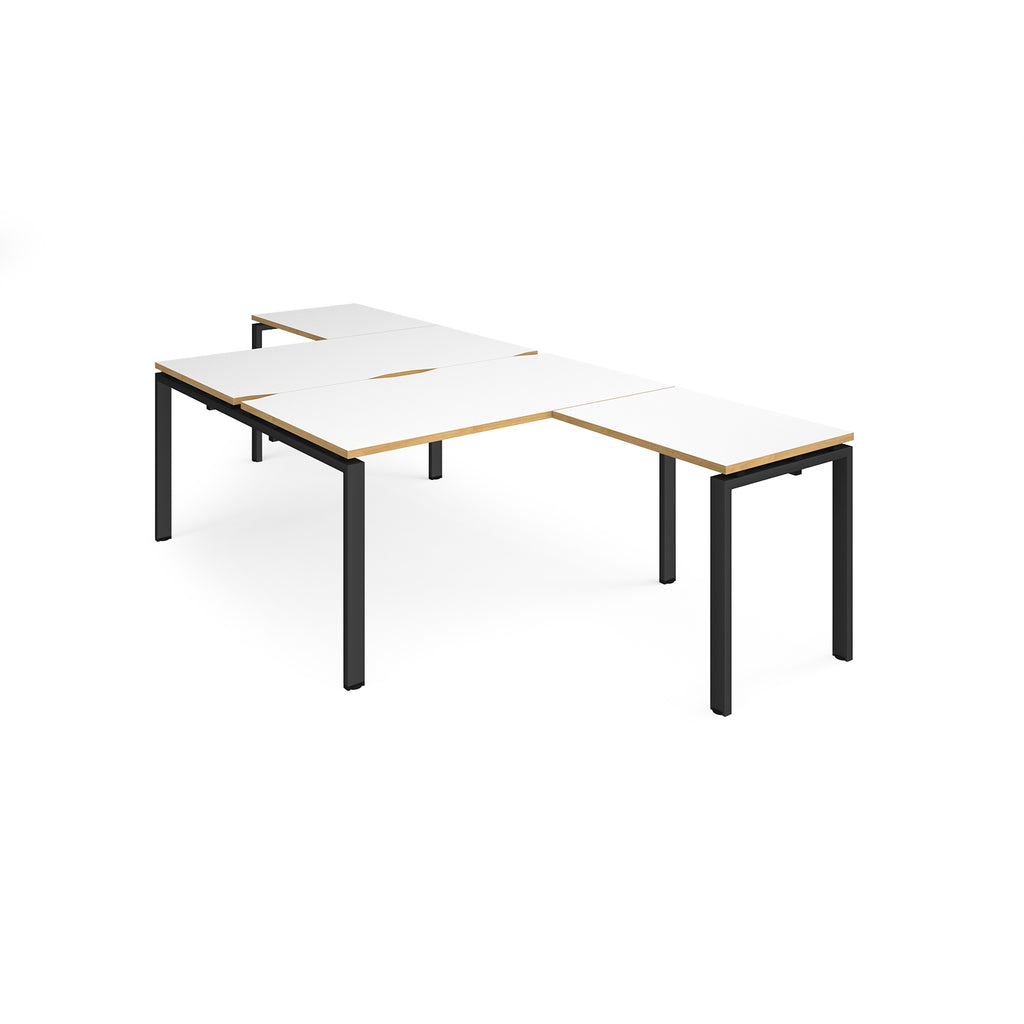 L-shaped back-to-back desks with white top with wooden edges and a black metal frame on a white background