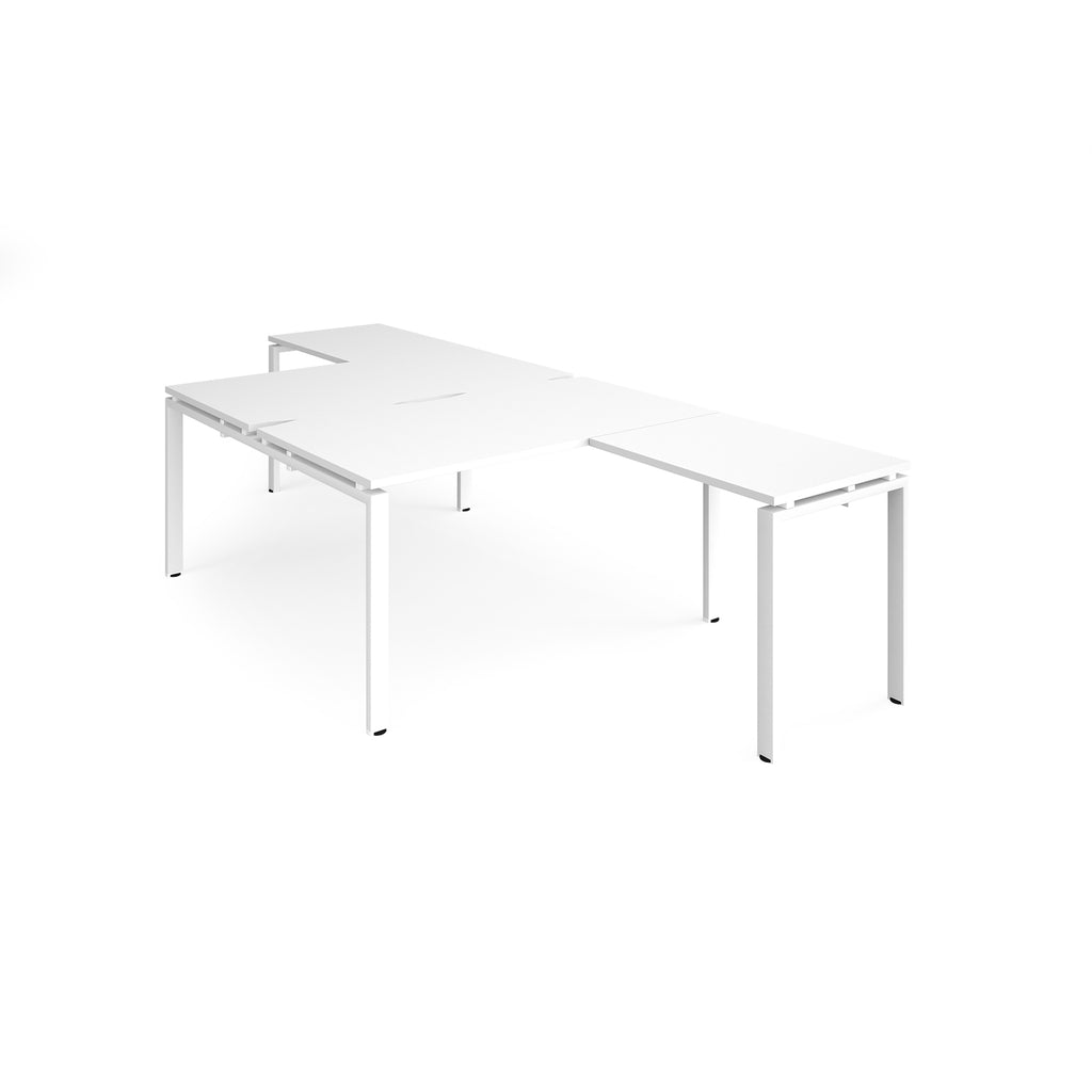 L-shaped back-to-back desks with white top and metal frame on a white background