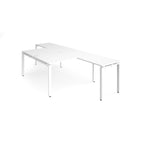 L-shaped back-to-back desks with white top and metal frame on a white background