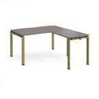 L-shaped desk with grey wood-effect top and green metal frame on a white background