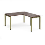 L-shaped desk with wood-effect top and green metal frame on a white background