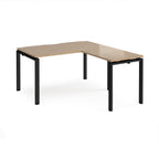 L-shaped desk with wood-effect top and black metal frame on a white background